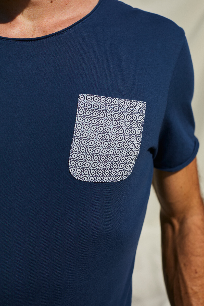 man wearing a navy t-shirt with azulejos pocket