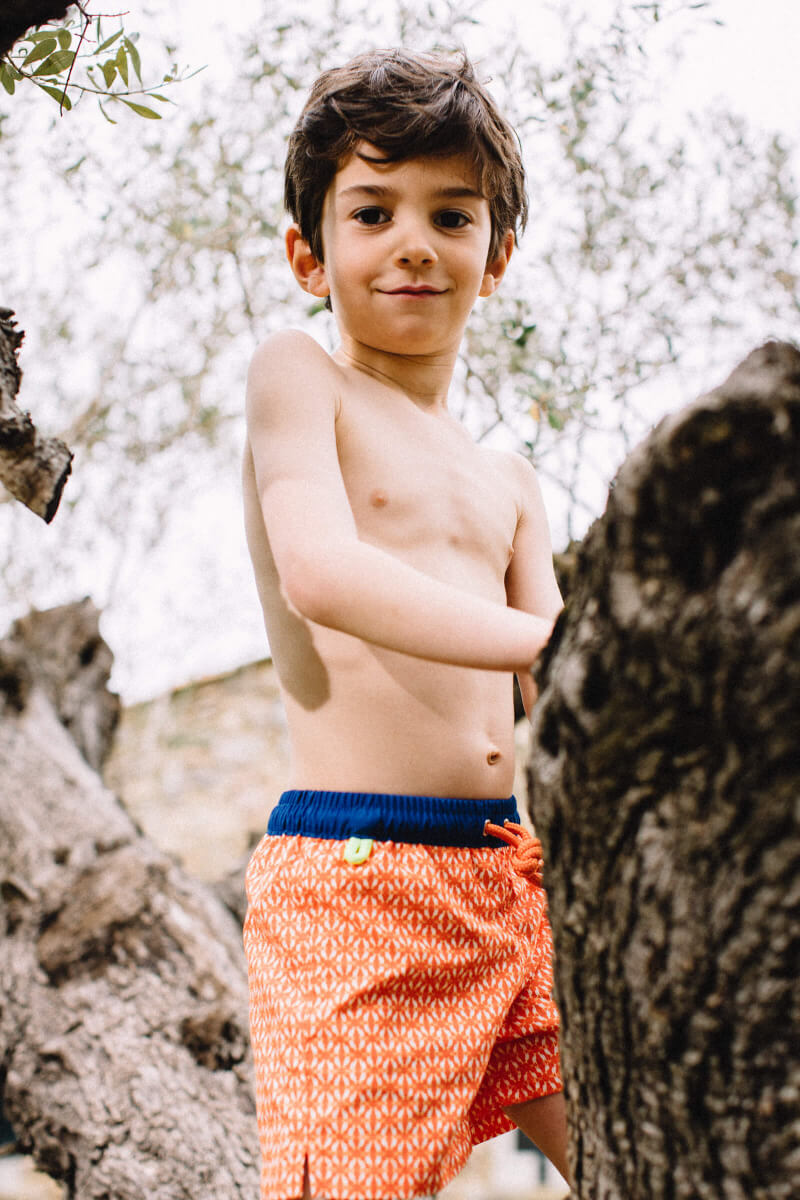 Boy wearing a swimsuit with elasticated belt orange Kangaroos