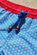man wearing a swimsuit blue asanoha