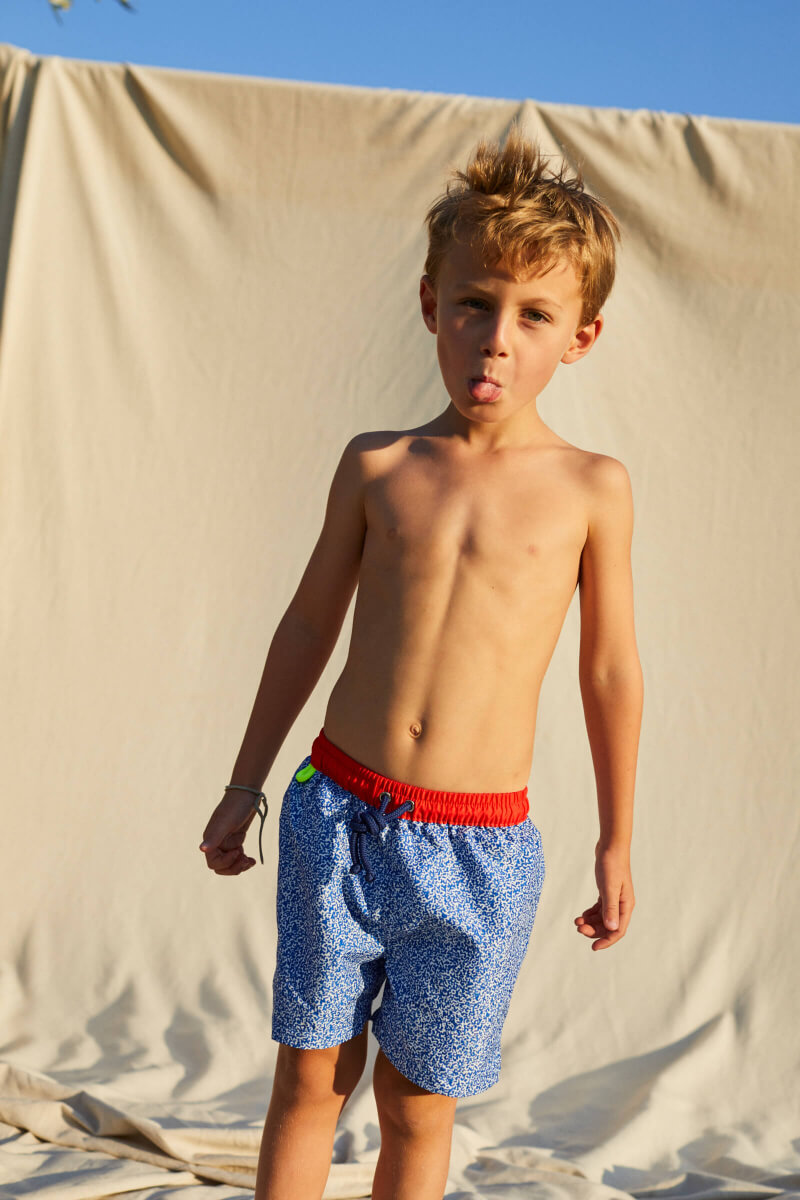 Boy wearing a swimsuit with buttoned belt Meno Off the Coast