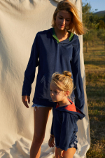 woman wearing a navy terry cloth sweat