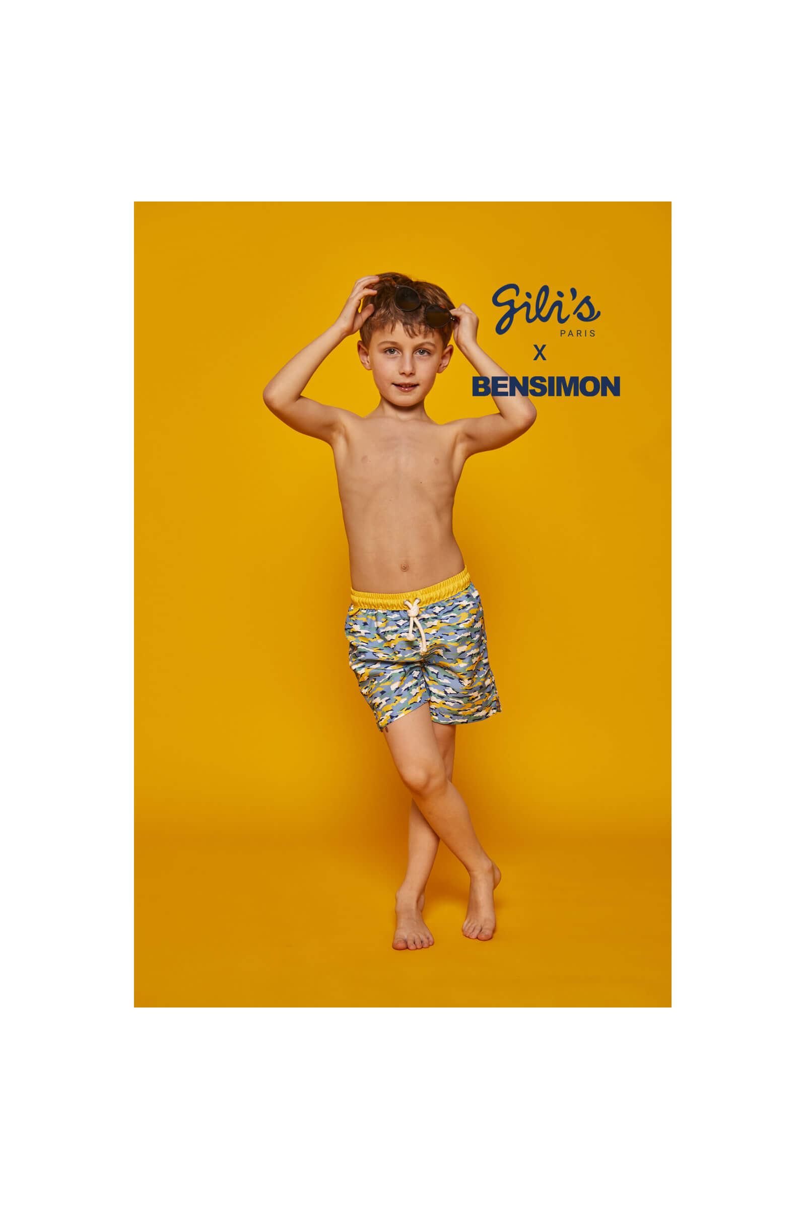 Boy wearing a swimsuit with buttoned belt Meno Camouflage GILI'S x BENSIMON