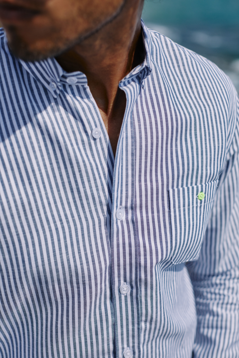Man wearing a Blue and white striped shirt