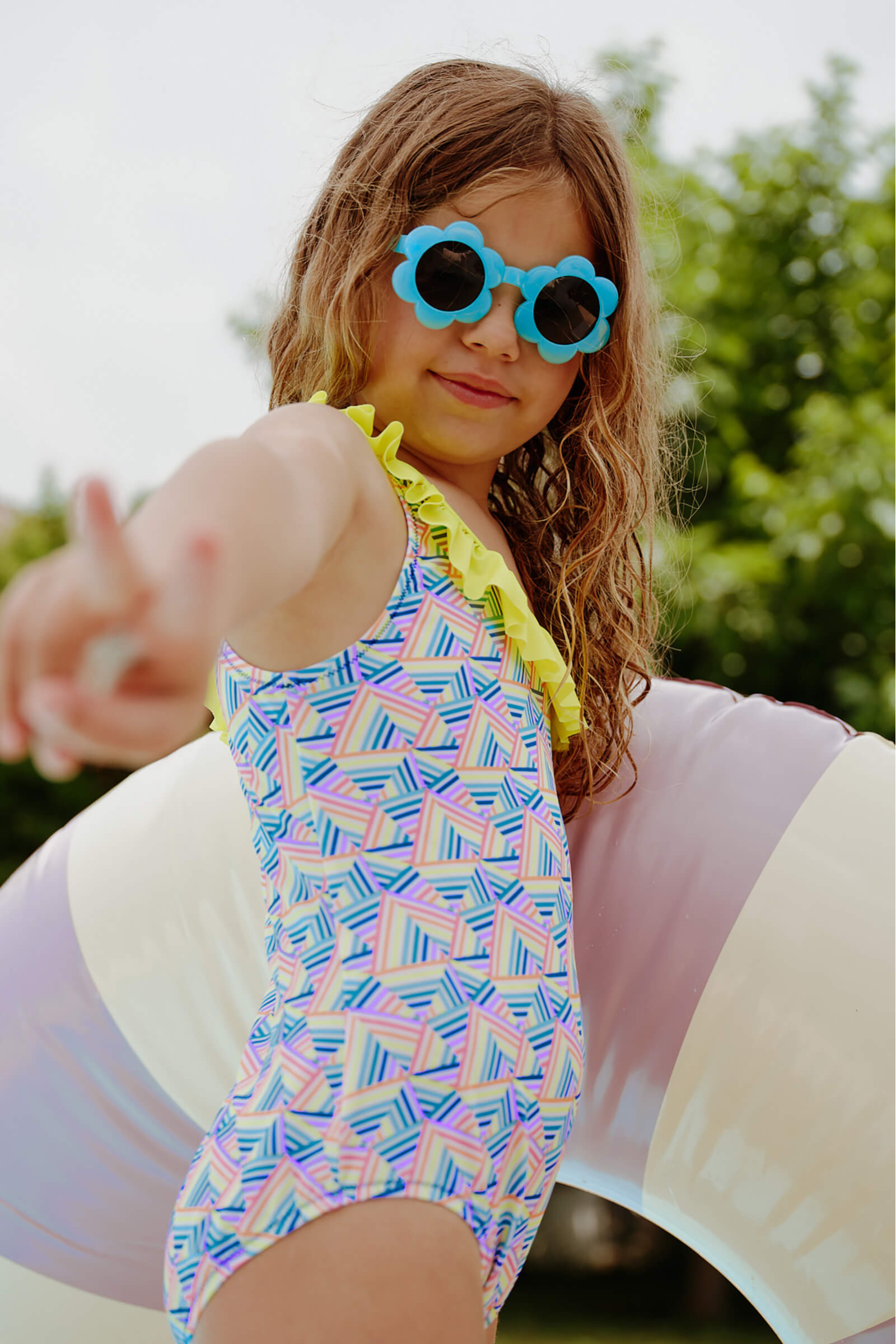 Girl wearing a one-piece swimsuit Rainbow Mountains