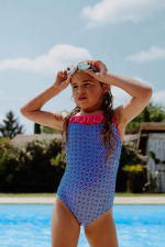 Girl wearing a Blue Sintra one piece swimsuit